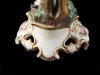 PAR DE CASTIÇAIS EM PORCELANA REPRESENTANDO “CASAL DE FIGURAS ILUSTRES”